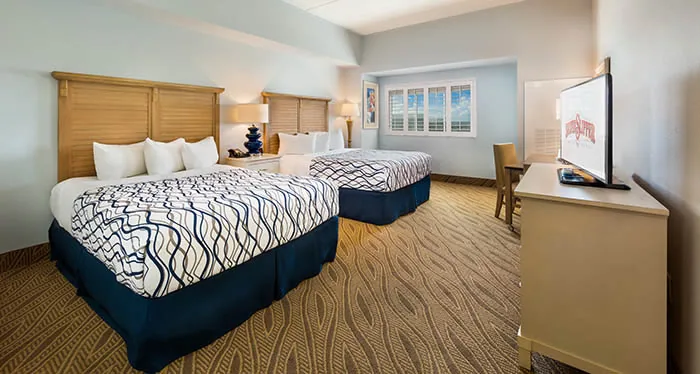 Silver Slipper guest room with two queen beds and coastal décor